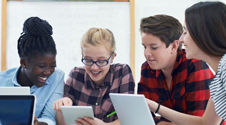 Junior high school kids with devices