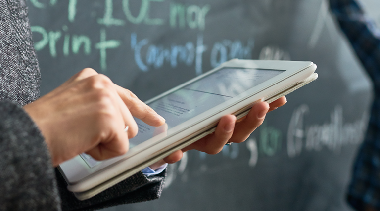 teacher on tablet