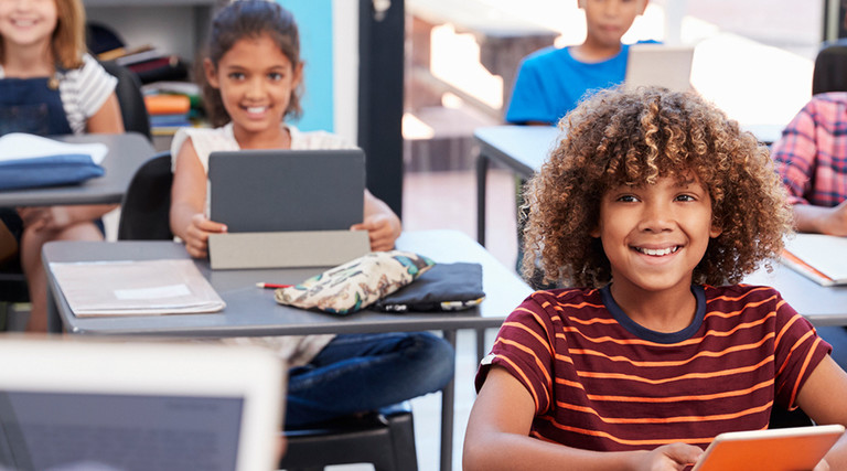 Elementary students using devices