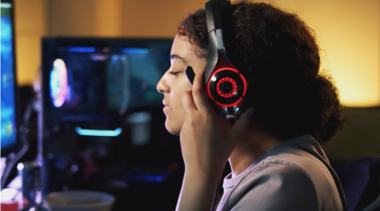 K–12 student playing esports with headset